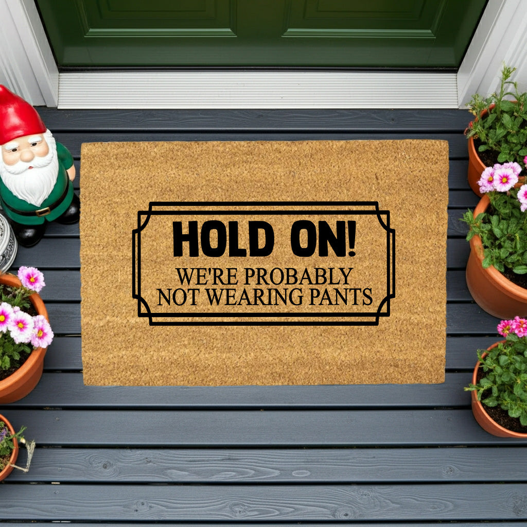 Funny “Hold On! We’re Probably Not Wearing Pants” Coir Doormat – Hilarious Welcome Mat | Humor Front Porch Decor | Gag Gift for Friends & Couples - Mallard Moon
