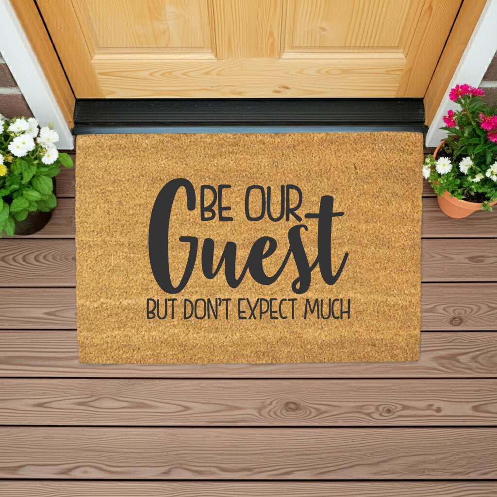 Be Our Guest But Don’t Expect Much Coir Doormat – Funny Welcome Mat | Rustic Farmhouse Front Porch Decor | Year-Round Entryway Rug - Mallard Moon