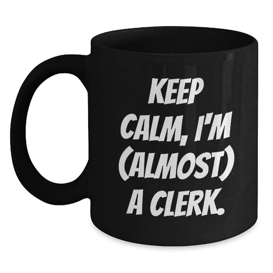 Funny Clerk Gifts for Men - Keep Calm, I'm Almost a Clerk Christmas Unique Mug, Black Coffee Mug for Clerks at Work - Main