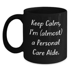 Funny Personal Care Aide Gifts from Friends to Family for Graduation - 'Keep Calm, I'm (almost) A Personal Care Aide.' Black Coffee Mug