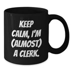 Funny Clerk Gifts for Men - Keep Calm, I'm Almost a Clerk Christmas Unique Mug, Black Coffee Mug for Clerks at Work
