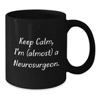 Funny Neurosurgeon Gifts for Men - Keep Calm, I'm (almost) A Neurosurgeon. Black Coffee Mug - Christmas Unique Gifts from Friends