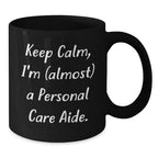 Funny Personal Care Aide Gifts from Friends to Family for Graduation - 'Keep Calm, I'm (almost) A Personal Care Aide.' Black Coffee Mug