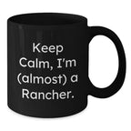 Rancher Humor Funny Quote Black Coffee Mug Gifts for Men from Friends, Christmas Unique Mugs for Rancher Enthusiast, Keep Calm I'm almost a Rancher Black 11oz or 15oz Ceramic Mugs