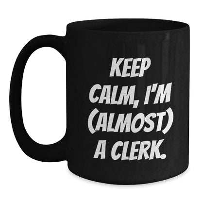 Funny Clerk Gifts for Men - Keep Calm, I'm Almost a Clerk Christmas Unique Mug, Black Coffee Mug for Clerks at Work - Main
