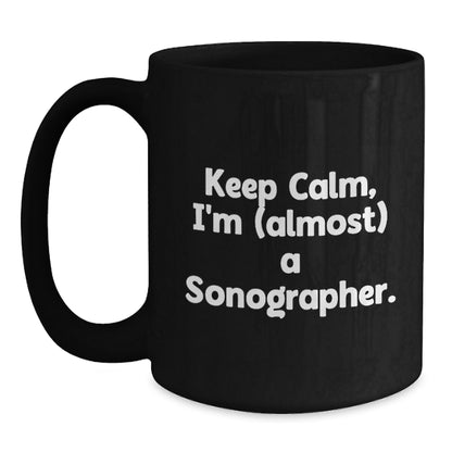 Funny Sonographer Gifts, 'Keep Calm, I'm (almost) A Sonographer.' Black Coffee Mug for Birthday, Gifts from Friends to Sonographer - Main