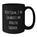 Funny Athletic Trainer Black Coffee Mug, 'Keep Calm, I'm (almost) An Athletic Trainer.' Gifts for Athletic Trainers from Friends and Family