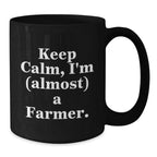 Funny Farm-Themed Gifts for Farmer Men, Women, and Friends - Black Ceramic Coffee Mug - Keep Calm, I'm (almost) A Farmer.