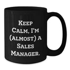 Funny Sales Manager Gifts from Friends - Keep Calm I'm (almost) A Sales Manager. Black Ceramic Coffee Mug for Birthday