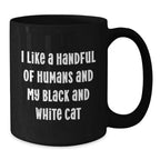 I Like a Handful of Humans and My Black and White Cat Mug – Funny Cat Lover Gift – Black Ceramic Coffee Cup