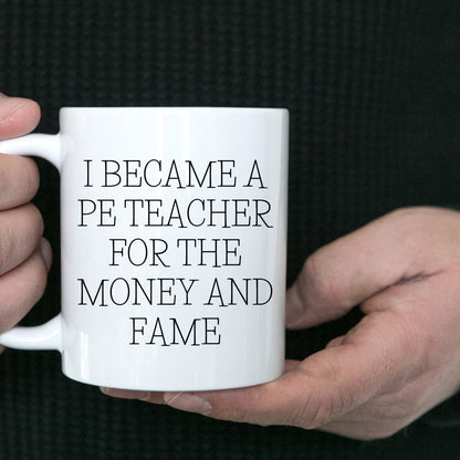 Funny PE Teacher Gifts for Men, Women, or Friends, White Coffee Mug, I Became A Pe Teacher For The Money And Fame Christmas Unique