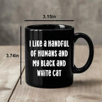 I Like a Handful of Humans and My Black and White Cat Mug – Funny Cat Lover Gift – Black Ceramic Coffee Cup