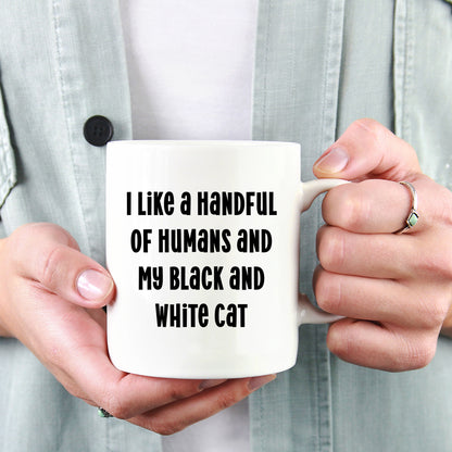 Funny Black and White Cat Gifts from Family for Birthday - I Like A Handful Of Humans And My Black And White Cat White Coffee Mug