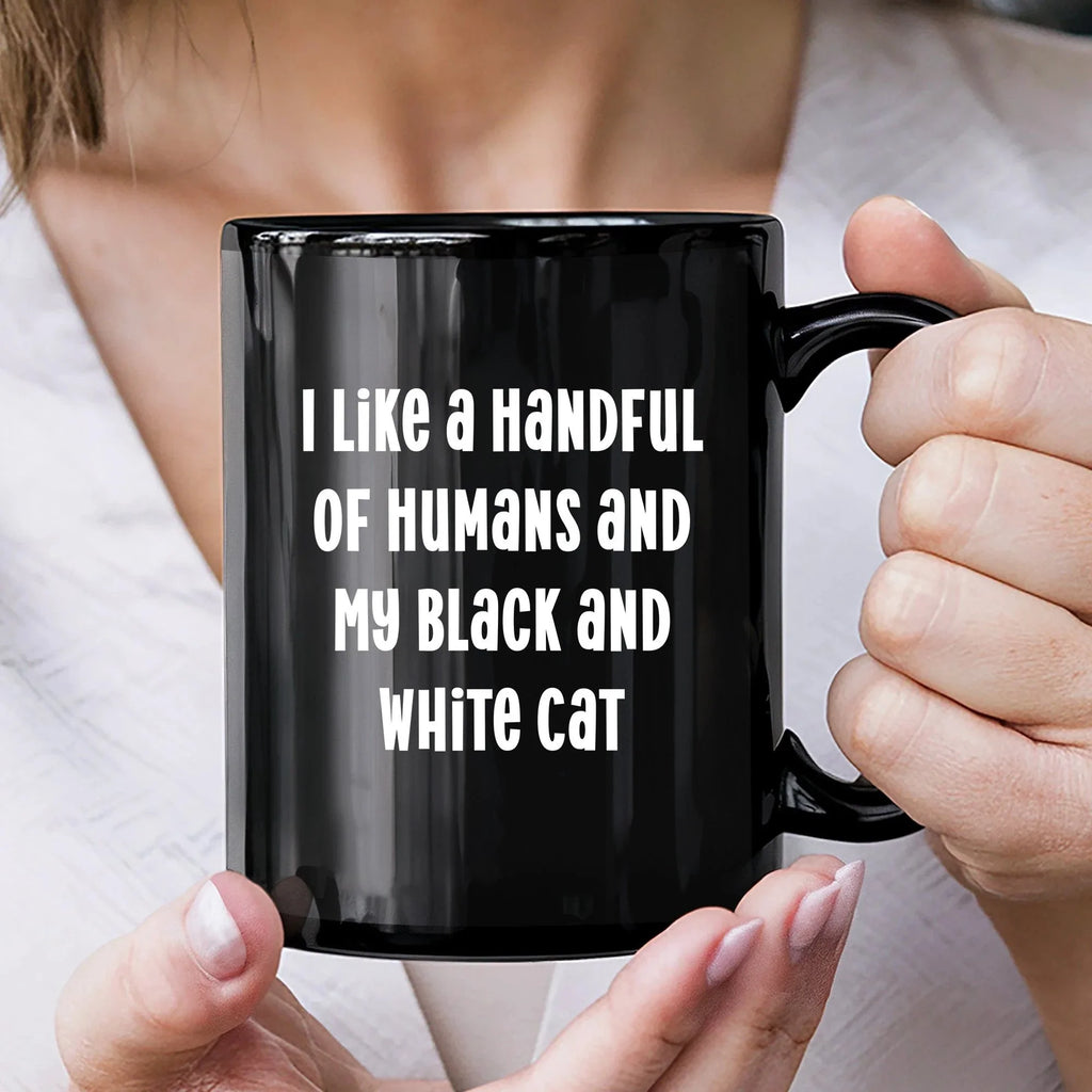 I Like a Handful of Humans and My Black and White Cat Mug – Funny Cat Lover Gift – Black Ceramic Coffee Cup