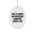 Funny Surgeon Gifts, Oval Ornament for Christmas, 'This Is What An Awesome Surgeon Looks Like' Quote, Gifts from Men, Women, Coworkers, Family & Friends, Unique Christmas Unique Gifts