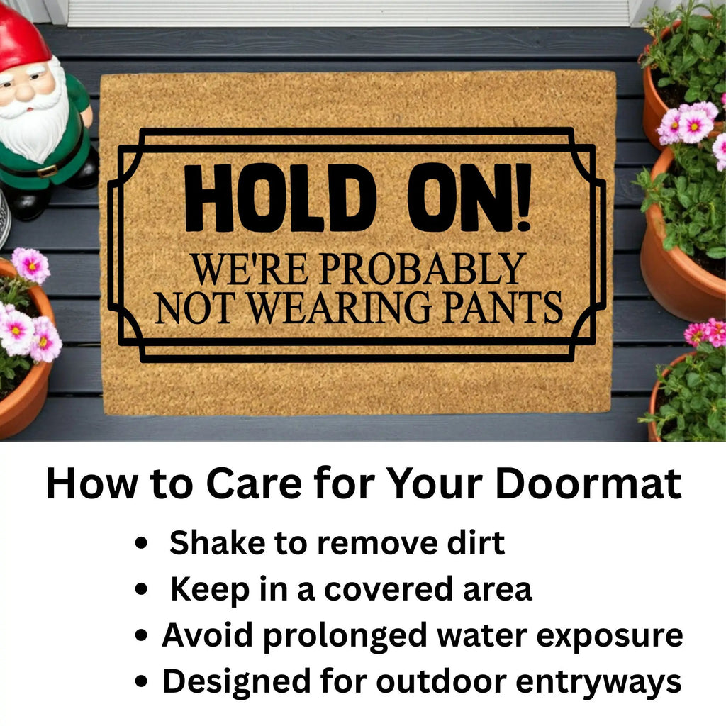Funny “Hold On! We’re Probably Not Wearing Pants” Coir Doormat – Hilarious Welcome Mat | Humor Front Porch Decor | Gag Gift for Friends & Couples