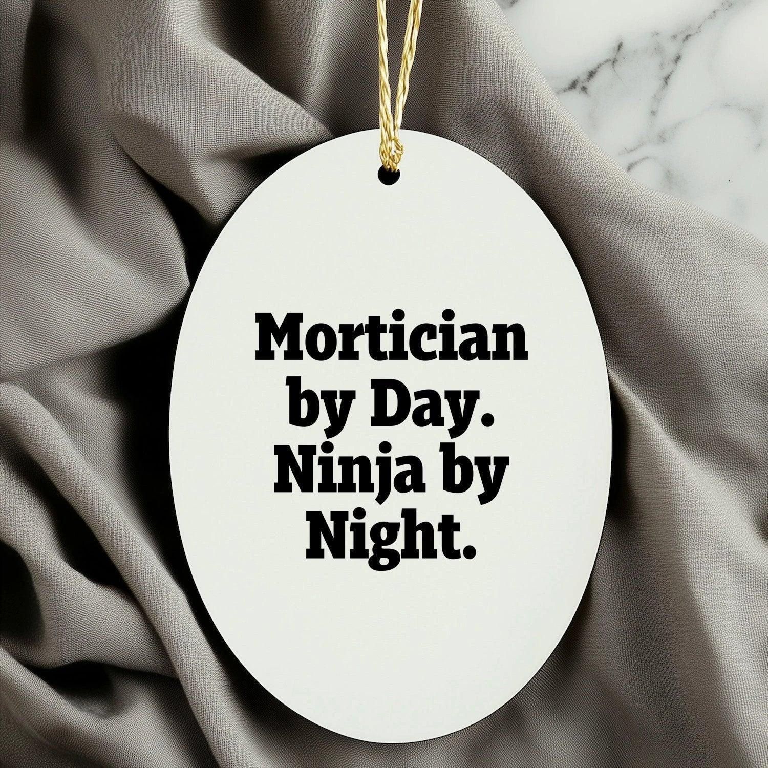 Mortician Gifts from Friends for Mortician By Day. Ninja By Night. Oval Ornament, Funny, White, 3.25 Tall, Christmas Unique