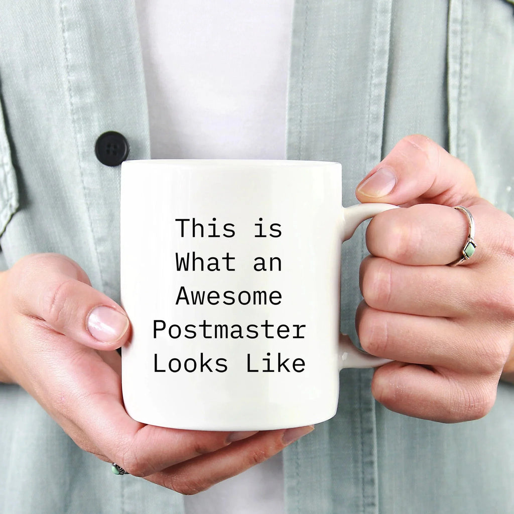 Funny Gifts for Postmaster - 'This Is What An Awesome Postmaster Looks Like' White Coffee Mug for Graduation, Made from Ceramic, Microwave and Dishwasher Safe, Gifts from Friends to Family