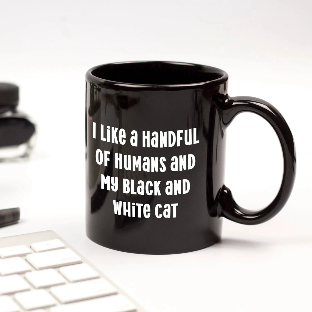 I Like a Handful of Humans and My Black and White Cat Mug – Funny Cat Lover Gift – Black Ceramic Coffee Cup