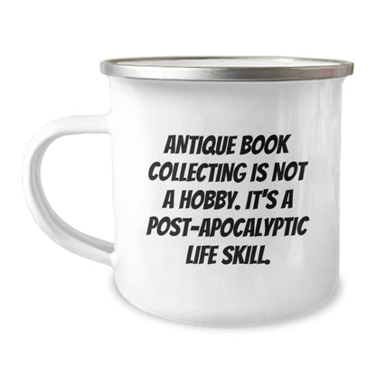 Antique Book Collecting Gifts for Friends, Women, and Family - 'Antique Book Collecting Is Not A Hobby. It's A Post-apocalyptic Life Skill.' Enamel Camping Mug for Graduation - Image 1