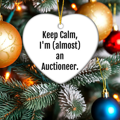 Funny Auctioneer Gifts from Friends, Keep Calm, I'm (almost) An Auctioneer, Heart Ornament for Men, Women, or Coworkers at Christmas Time