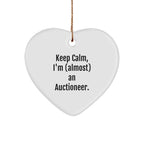 Funny Auctioneer Gifts from Friends, Keep Calm, I'm (almost) An Auctioneer, Heart Ornament for Men, Women, or Coworkers at Christmas Time