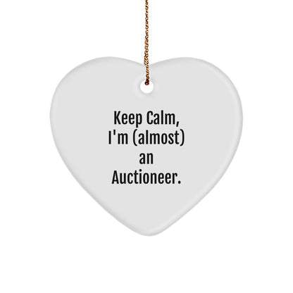 Funny Auctioneer Gifts from Friends, Keep Calm, I'm (almost) An Auctioneer, Heart Ornament for Men, Women, or Coworkers at Christmas Time