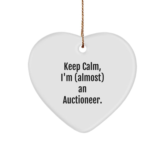 Funny Auctioneer Gifts from Friends, Keep Calm, I'm (almost) An Auctioneer, Heart Ornament for Men, Women, or Coworkers at Christmas Time