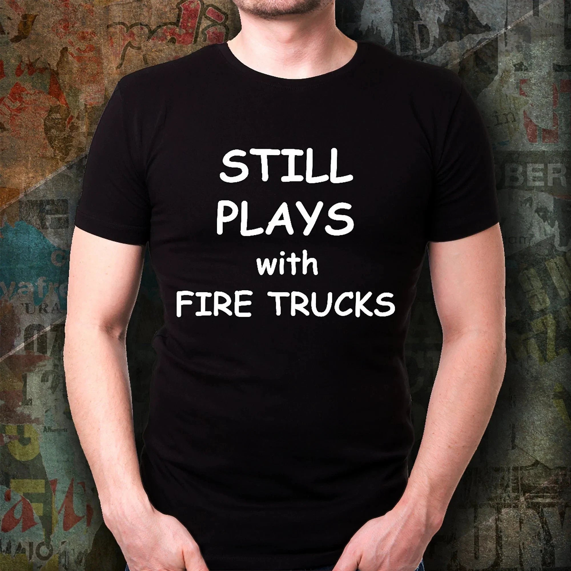Firefighter Funny T-shirt - Still Plays with Fire Trucks