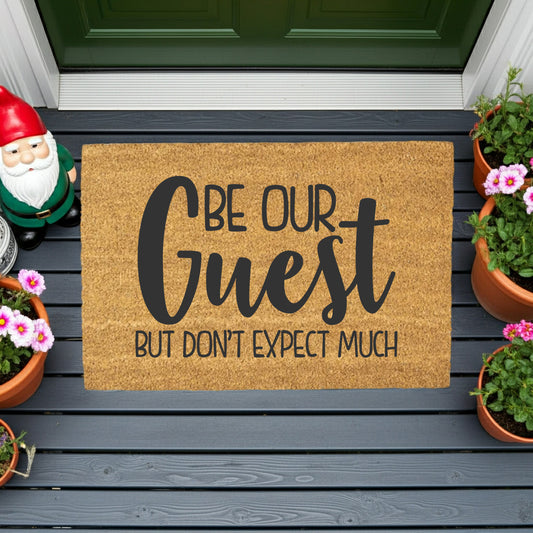 Be Our Guest But Don’t Expect Much Coir Doormat – Funny Welcome Mat | Rustic Farmhouse Front Porch Decor | Year-Round Entryway Rug - Mallard Moon
