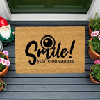 Funny Security Doormat - Smile! You’re on Camera | Coir Welcome Mat for Home Surveillance | Humorous Front Porch Décor