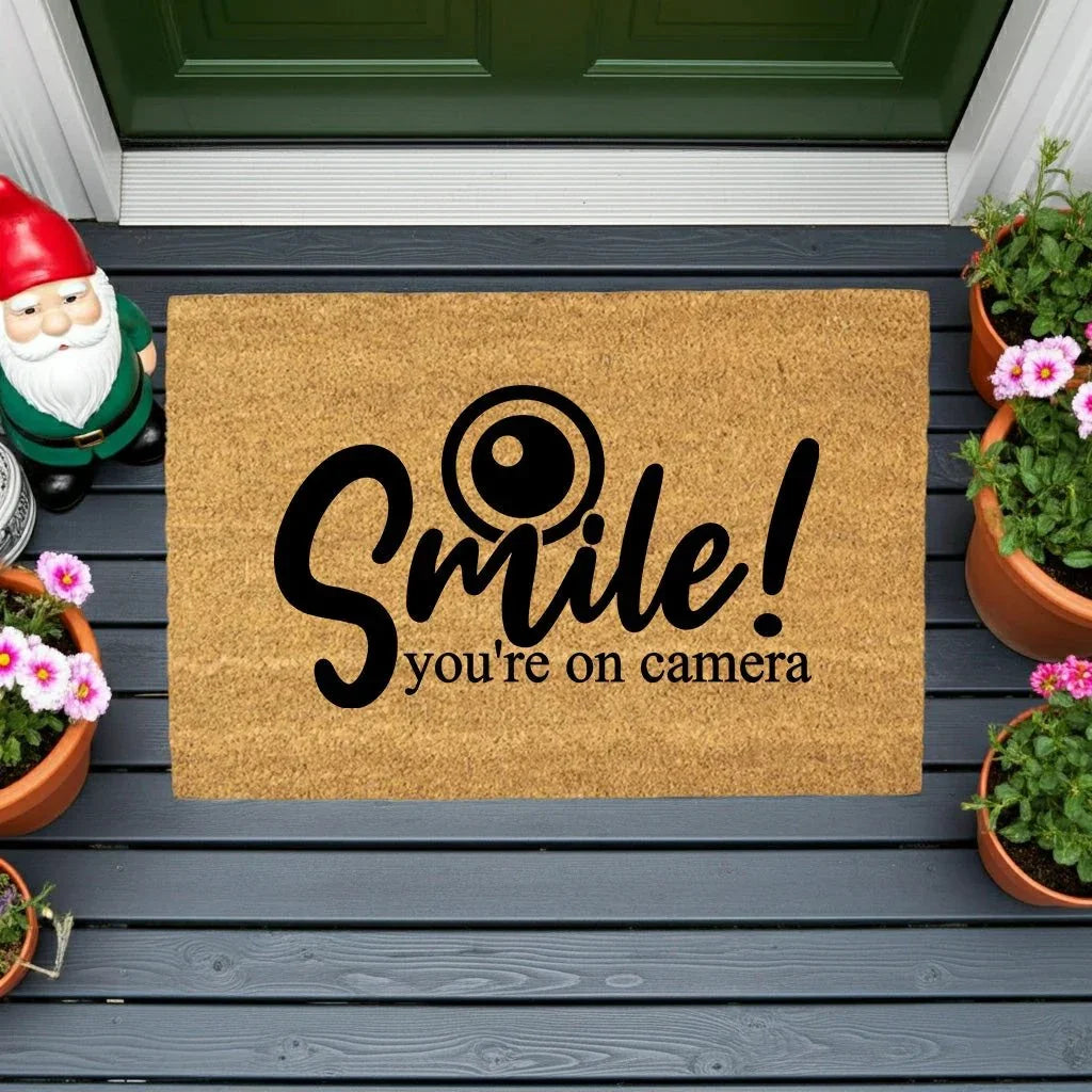Funny Security Doormat - Smile! You’re on Camera | Coir Welcome Mat for Home Surveillance | Humorous Front Porch Décor