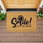 Funny Security Doormat - Smile! You’re on Camera | Coir Welcome Mat for Home Surveillance | Humorous Front Porch Décor