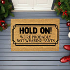 Funny “Hold On! We’re Probably Not Wearing Pants” Coir Doormat – Hilarious Welcome Mat | Humor Front Porch Decor | Gag Gift for Friends & Couples
